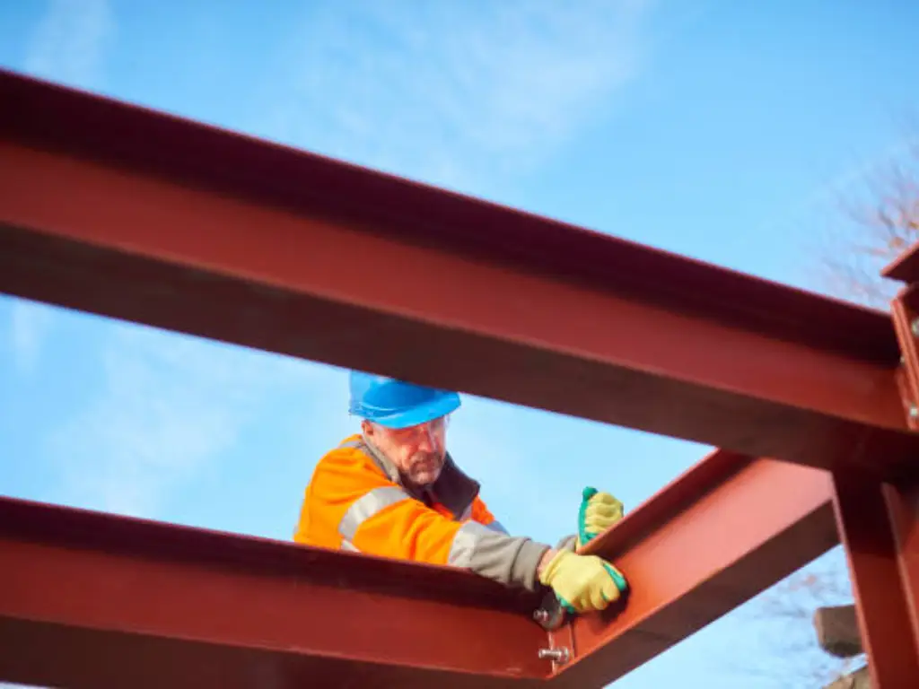 a man is using contrusction screws to securing the framing