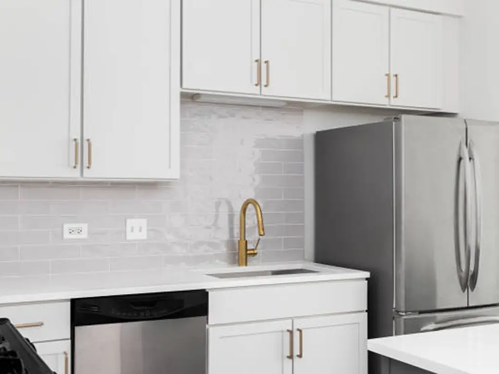 white cabinets and gold cabinet hardware